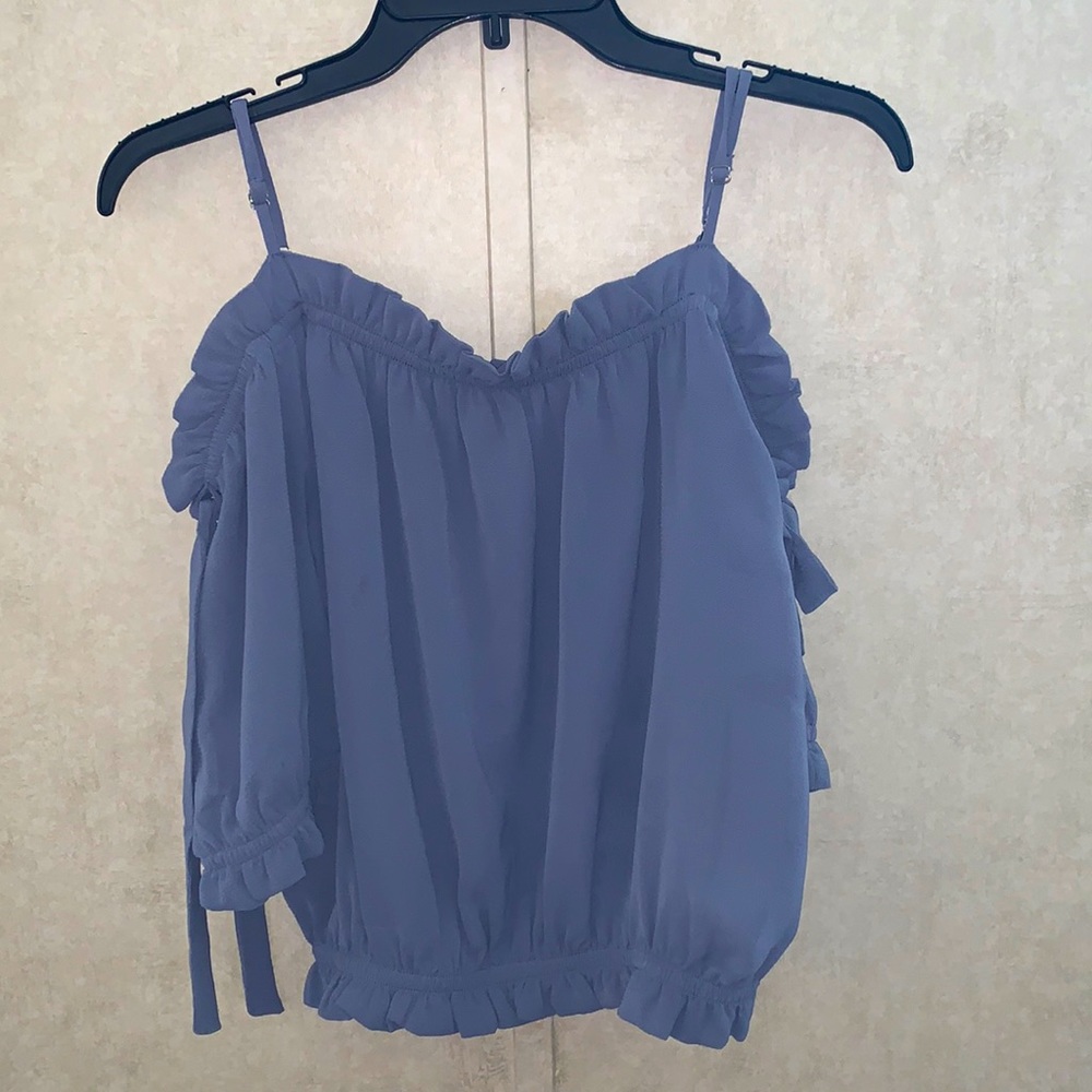 Dusty blue blouse. Color is darker/more grey blue in person.
